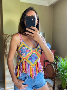 "\"Colorful Fringed Crochet Crop Top'' This Colorful boho top designed to give you unique look. You can combine this crochet top with high waist jeans,shorts or skirts. Also this crochet crop top looks great as a beach wear or festival top. I crocheted this tank crop top soft premium quality cotton. it's soft on the skin, and floats on your body like a soft cloud. This crop top is MADE TO ORDER please allow 3-5 days from order to dispatch. SİZE AND FİT Model is wearing Small Size Size : XS Bust Sleeveless Granny Square Crochet Top For Vacation, Bohemian Crochet Top For Music Festival, Bohemian Handmade Crochet Top For Festivals, Handmade Bohemian Crochet Top For Festivals, Multicolor Hippie Tops For Festivals, Summer Hippie Crochet Top With Granny Square, Multicolor Bohemian Crochet Top For Vacation, Multicolor Bohemian Crochet Top For Beach, Hippie Granny Square Crochet Top For Summer