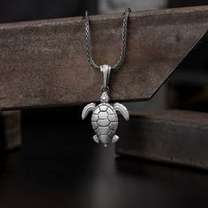 Sea turtle caretta necklace silver pendant for men or women, Sterling silver animal lover Jewelry, Ocean turtle Gift charm pendant for mom These pieces symbolise the wearer's connection to the qualities of longevity, wisdom, and protection. A popular choice for those seeking a subtle yet meaningful adornment. This sea turtle pendant features exclusive handmade engraving details, photographed with original products. Very elegant and stylish for everyday wear, this necklace adds a classy look to y Silver Turtle Necklace For Gift, Sterling Silver Turtle Necklace For Gifts, Silver Sterling Silver Turtle Jewelry, Sterling Silver Turtle Necklace For Gift, Ocean Turtle, Jewelry Ocean, Lover Jewelry, Turtle Gifts, Pendant For Men