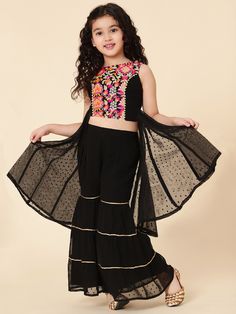 PRODUCT DETAILS Black printed Top with Sharara with dupatta Top design: Floral printed A-line shape Regular style Round neck, sleeveless no sleeves Above knee length with flared hem Poly georgette machine weave fabric Sharara design: Solid Sharara Partially elasticated waistband Slip-on closure Material & Care Shell-100% Polyester, Exclusive Of Decoration , Lining-100% cotton Wash Care Instruction -  Hand washable with cold water Do not tumble dry, put the clothes in shade to dry. Ironing Instruction- Use low heat iron Do not iron prints/embroidery on clothes and if needed iron prints inside out. Cheap Tops With Unique Design For Diwali, Cheap Tops For Diwali Puja, Top With Sharara, Sharara Design, Sharara Designs, Baby Event, Diwali Sale, Indian Dress, Embroidery On Clothes