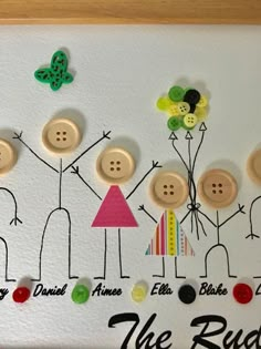 a family tree made out of buttons on a white board