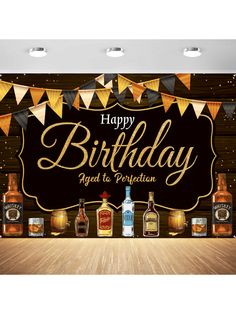 a happy birthday banner with liquor bottles