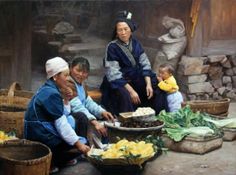 a group of people sitting around a table with food on top of it in front of a stone wall