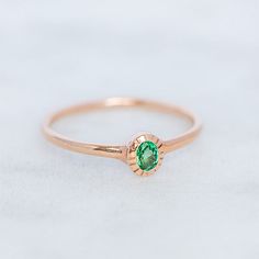 Our slightly wonky Forest Stacking Ring is set with an oval emerald. Emerald measures 4 x 3mm. Band width 1.5mm. Weight 2g approx. Pictured in the first image with a matte finish. For a high shine finish please leave a note at checkout. Green Emerald Stackable Ring, Everyday Oval Emerald Ring For May Birthstone, Green Oval Stackable Rings For May Birthstone, Everyday Oval Emerald Birthstone Ring, Minimalist Green Oval Stackable Rings, Stackable Green Emerald Ring, Minimalist Oval Emerald Ring For May Birthstone, Oval Emerald Stackable Rings, Green Emerald Stackable Rings In Minimalist Style