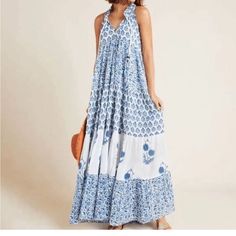 Cotton Tiered Sleeveless Maxi Dress With Blue And White Floral Print And Ties At Neck. Perfect For Beach And Summer. Breathable Soft Cotton Fabric. New With Tags Anthropologie Ro’s Garden Can Fit Xs-M Summer Cotton Sleeveless Maxi Dress, Summer Sleeveless Cotton Maxi Dress, Cotton Sleeveless Maxi Dress For Summer, Cotton Sleeveless Maxi Dress For Vacation, Bohemian Sleeveless Cotton V-neck Dress, White Bohemian Sleeveless Dress With Floral Print, White Bohemian Sleeveless Maxi Dress, Bohemian Maxi Sleeveless Dress For Garden Party, White Bohemian Sleeveless Dress