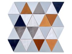 an image of a mosaic tile design with different colors and shapes on it's surface