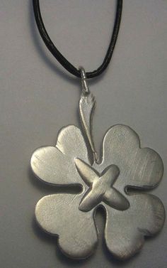 "SILVER CLOVER pendant Pendant is a silver clover, an amulet of the classic 4-leaf clover in sterling silver. It is a reversible clover pendant, it can be seen on both sides, on one of them the silver clover is engraved with the words \"good luck\" in 4 languages. Dimensions of the silver clover amulet: 3 cm x 3 cm CLOVER SYMBOL ORIGIN (for silver clover pendant) The 4-leaf clover, is the so-called lucky clover, has its origin in Celtic Europe and especially Ireland is the country where the clov Silver Necklaces With Flower Charm For Good Luck, Silver Necklace With Flower Charm For Good Luck, Clover Symbol, Clover Leaves, Celtic Pendant, Clover Pendant, Charm Necklace Silver, Lucky Clover, Silver 925 Necklace