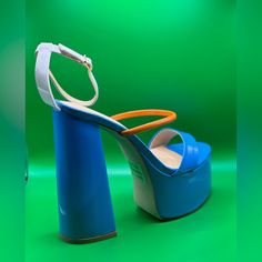 Round Toe Platform With Straps, A Orange Strap Across The Foot Trendy Blue Ankle Strap Heels, Spring Light Blue Platform Heels, Chic Blue Platform Sandals, Blue Wrapped Heel Spring Heels, Spring Blue Heels With Wrapped Heel, Chic Blue Heels For Spring, Blue Platform Heels For Spring, Orange Heels, Blue And Orange