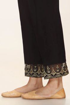 Black Self Latest Pakistani Pant Discover Timeless Style: Limited Edition Black Self Trouser in Black Cambric | Rangreza latest pakistani fashion Elevate your style with our Black Self Trouser. Tailored from black-colored Cambric, this one-piece wonder ensures a perfect fit. Hurry, limited stock available - shop now! Elegant Bottoms With Dupatta For Eid, Elegant Black Sets With Straight Pants, Elegant Eid Bottoms With Embroidered Border, Elegant Embroidered Eid Bottoms, Elegant Bottoms With Embroidered Border For Eid, Bollywood Style Bottoms For Eid Party, Elegant Festive Bottoms With Dabka Details, Party Pants With Dupatta For Eid, Bollywood Style Party Bottoms For Eid