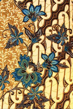 an intricately designed wallpaper with blue flowers and leaves on gold foiled paper