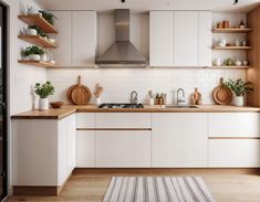 a kitchen with white cabinets and wooden counter tops, an area rug on the floor