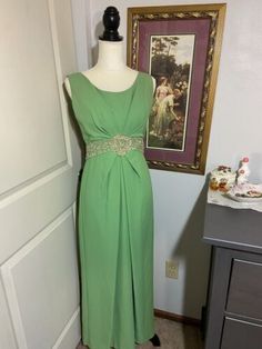 Vintage Empire Waist Evening Dress, Green Lined Vintage Dress, Vintage A-line Maxi Dress For Evening, Mid-century Style Spring Formal Dresses, Green Vintage Dress For Evening, Green Retro Evening Dress, Vintage Empire Waist Maxi Dress For Formal Events, Retro Green Evening Dress, Vintage Floor-length Maxi Dress For Formal Occasions