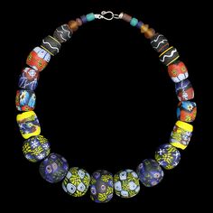 A large necklace comprising of glass bead replicas from Eidem, Norway. Wear as a standalone necklace, or attach between tortoise brooches. For Viking men or women. Total length: approx 50cm (19.7 inch). Beads range from 5mm - 30mm (0.2 - 1.2 inch) wide. Metal clasp for easy closure. Hand-painted & plain glass replica beads from 9th - 10th century Norway. Total weight approx. 302g (10.65oz) approx. Last image shows the original necklace from the museum of Norway. Vintage Glass Necklaces With Oval Beads, Vintage Glass Necklace With Oval Beads, Unique Glass Pendant Necklaces, Artisan Glass Jewelry With Large Beads, Unique Glass Pendant Necklace, Unique Glass Necklaces For Jewelry Making, Artisan Glass Necklaces With Unique Variations, Artisan Single Strand Glass Necklace, Unique Round Bead Glass Jewelry