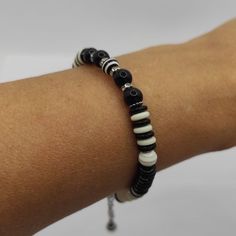 Black and white agate bracelet unisex beaded bracelet beach bracelet trending bracelet gemstone black agate bracelet for women coin bracelet This original bracelet made of black agate and striped beads will be a sophisticated addition to your look. Stylish coin-shaped beads add a touch of elegance to the bracelet. The unique design allows you to wear this bracelet not only on your wrist but also on your ankle, making it a versatile accessory for any occasion. Add a touch of luxury to your style Black Natural Stones Jewelry For Beach, Minimalist Round Beads Bracelets For Beach, Trendy Black Bead Bracelets For Gifts, Trendy Adjustable Bracelet With Black Beads, Trendy Adjustable Black Beads Bracelet, Trendy Black Bracelets For The Beach, Trendy Black Bracelets For Beach, Casual Black Beaded Bracelet, Trendy Adjustable Round Beaded Bracelets