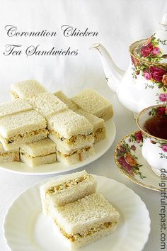 tea sandwiches on plates next to a tea pot