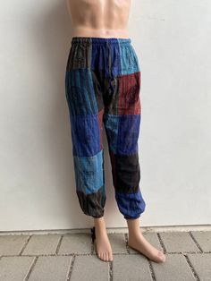 Colorful 100% cotton pants with patchwork and Nepali hand printed artwork. 2 Deep pockets on each side and one on the back. Simple drawstring elastic waist. Comfortable pants and great hippie pants Hippie/Boho pants. Easy to wear and lovely colors. These are unisex ! One size: fits S - M Waist 24-44in Length 38in Free shipping Made in Nepal 🇳🇵 Visit our page for more patchwork colors! Please message with any questions! Casual Festival Pants With Patchwork, Casual Patchwork Pants For Festival, Hippie Patchwork Pants For Festival, Hippie Festival Pants With Patchwork, Hippie Style Patchwork Harem Bottoms, Hippie Harem Bottoms With Patchwork, Hippie Patchwork Bottoms For Festival, Hippie Patchwork Harem Bottoms, Hippie Blue Patchwork Bottoms