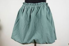 Vintage sage green mini skirt in mint condition. Seems handmade Shell feels cotton polyester blend Lining feels like cotton spandex blend Fits like women size M waist 34 cm = 13.4 inches hips open length 42 cm = 16.5 inches Green Mini Length Cotton Bottoms, Green Mini-length Cotton Bottoms, Green Stretch Cotton Skort, Green Mini Cotton Bottoms, Green Cotton Mini Bottoms, Green Cotton Mini Skirt With Elastic Waistband, Cotton Mini Skort With Gathered Skirt, Fitted Green Cotton Mini Skirt, Green Stretch Short Skirt