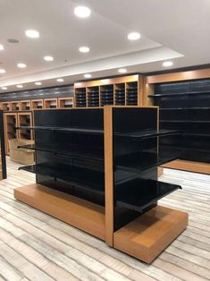 empty shelves in a store with wooden flooring