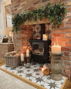 Farmhouse brick style fireplace Living Room Logburner, Christmas Log Burner Fireplace, Log Burner Christmas Decorations, Tv On Wall Next To Fireplace, Decorative Logs In Fireplace, Fireplace Logs Decorative, Cozy Cottage Style Living Room, Brick Hearth Ideas, Red Brick Fireplace Living Room