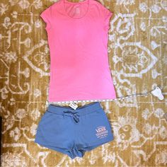 Bnwt Light Baby/Sky Blue And Pink Vans Sweatpants Material Low Waist/Hipster Tie Waist Short Shorts Size Xs Bnwot Hot/Neon Pink V-Neck Short Sleeve Poof -Shirt (Says Size M But I Would Say It Fits Like A S. I Am Usually An Xs Or S And It Fits Me Like A Normal Size S) ***In The Pics With Measurements, Start At 2 And Minus 1 Inch Because Tape Measure Isn't Correct, The 1 Inch Isn't A Full Inch ***All Items Come From Pet And Smoke Free Home Pink Cotton Casual Sleepwear, Casual Pink Cotton Sleepwear, Pink Stretch Short Top, Vans Blue Short Sleeve Tops, Blue Short Sleeve Vans Top, Pink Short Athleisure Top, Vans Cotton Bottoms For Spring, Spring Cotton Bottoms By Vans, Basic Pink Cotton Bottoms