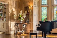 a grand piano in the middle of a living room