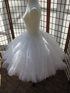 This listing is for a custom order for me to make a duplicate of the double layer white petticoat shown in the photos, except it will be made to fit your waist and desired length. It will be made of soft nylon organdy with polyester bridal satin waist. The pictured petticoat was designed for a 29 inch (73,5cm) waist and is 25 inches (63,5cm) long. Please feel free to ask me any questions :) WAIST: Please select your waist from the listed ranges in inches or centimeters. LENGTH: Please let me kno White Tulle Petticoat With Attached Cancan, White Petticoat For Costume, Elegant White Petticoat For Costume, White Crinoline Petticoat With Attached Cancan, Elegant White Crinoline Petticoat, Dream Daughter, Junk Kouture, White Petticoat, White Umbrella