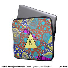 a laptop case with a colorful design on the front and side, featuring an image of a letter k