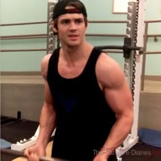 a young man is working out in the gym