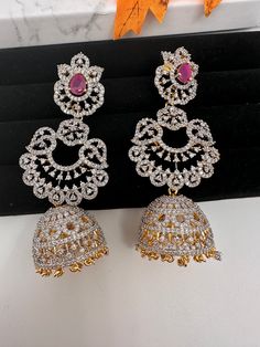 American Diamond Finish Color Stone Jhumka Earings - Red Red Hand Set Chandbali Jhumkas, Red Chandbali Hand Set Jhumkas, Red Chandbali Jhumkas With Hand Set, Heavy Red Ruby Earrings, Festive Red Hand Set Jhumkas, Red Hand Set Chandbalis For Celebration, Elegant Red Round Jhumkas, Red Hand Set Jhumkas For Festive Occasions, Hand Set Red Jhumkas For Festive Occasions