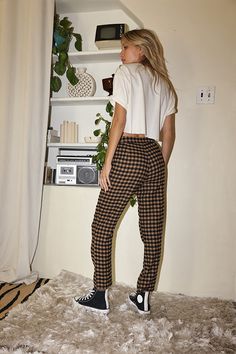 You are the trend setter in the Bishop Tan Checkered Cropped Trousers. Made with everyone's favorite checkered print and a straight leg fit, these are the pants you have been searching for! Style with a cropped tee or a chunky sweater, you will be able to rock these trousers in every way imaginable. STYLE RECOMMENDATIONS: - pair with some high tops and a cropped tee for a casual look, or spice it up with some wrap sandals and statement earrings SIZE RECOMMENDATIONS & MATERIALS: - light weight t Fall Houndstooth Trousers, Fall Houndstooth Straight Pants, Fall Houndstooth Pattern Straight Bottoms, Plaid Tapered Leg Pants For Fall, Houndstooth Straight Pants For Fall, Straight Pants With Houndstooth Pattern For Fall, Plaid Straight Pants With Relaxed Fit, Plaid Relaxed Fit Straight Pants, Relaxed Fit Plaid Straight Pants