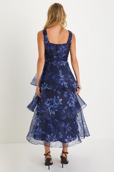 Everyone will be wowed when you walk in wearing the Lulus Dramatic Glamour Navy Blue Floral Organza Tiered Midi Dress! Airy woven organza boasts a moody floral print as it shapes wide tank straps and a square neckline. Banded waist boasts chic gathered details, atop a voluminous tiered skirt that falls to a long midi hem. Hidden zipper/clasp at side. Fit: This garment runs small - please size up. Length: Mid-calf length. Size medium measures 50.5" from shoulder to hem. Bust: Works best for A to Guest Aesthetic, Family Color Schemes, Floral Organza Dress, Dress Organza, Navy Blue Midi Dress, Long Midi, Lulu Fashion, Guest Attire, Chiffon Midi Dress