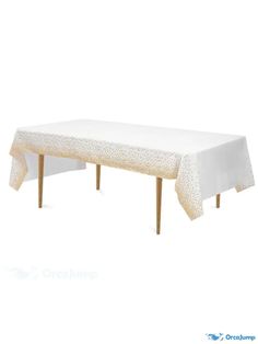 a white table cloth with gold dots on it