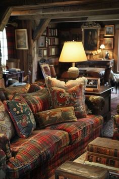 a living room filled with furniture and lots of pillows on top of it's couches