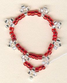 a red beaded bracelet with silver beads