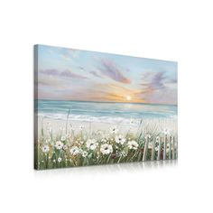 a painting on the wall of a beach with white flowers and grass in front of it