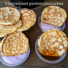 four different types of pancakes in plastic containers