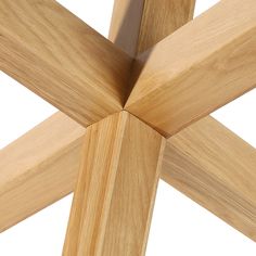 a close up view of the top of a wooden structure with four intersecting sections,