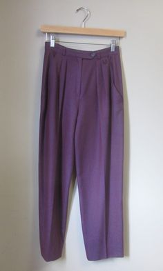 Vintage Emanuel Ungaro trousers. high waist. pleat front. tapered leg. ankle length. slant hip pockets. zip fly closure. crystal embellished logo at front waist. ✩ These pants are an amazing find, rare! Circa 1990s Emanuel Ungaro Made in Italy 100% Wool Eggplant Purple Excellent Condition. No notable flaws. ✂----M e a s u r e m e n t s: all in inches. Waist: 26 Hips: up to 38 Inseam: 26 Rise: 13 Length: 38 All measurements are taken flat. ❉ this is a vintage item and there is ONLY one! Item no. Formal Purple Bottoms With Pockets, Purple Straight Pants For Formal Occasions, Formal Purple Straight Pants, Formal Full-length Purple Bottoms, Purple Formal Full-length Bottoms, Purple Full Length Formal Bottoms, Full Length Purple Formal Bottoms, Formal Fitted Purple Bottoms, Elegant Purple Bottoms With Pockets