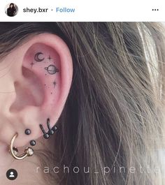 an ear with some piercings attached to it