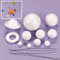 an assortment of white objects on a purple surface