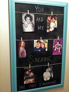 a chalkboard with pictures hanging on clothes pins and the words you are my sunshine, my only sunshine