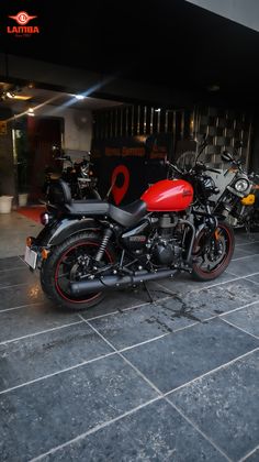 two motorcycles parked next to each other in a building