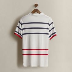 Part of the Spring 1992 Polo Stadium collection. Made in America. Striped interlock Polo shirt with a logo at the front. Size large has approximately a 29" back body length a 19.25" shoulder and a 46" chest. Classic White T-shirt With Contrast Stripes, Classic Polo T-shirt With Striped Collar, Classic White Shirt With Signature Stripes, White Classic T-shirt With Ribbed Collar, White Collared Top With Signature Stripes, White Collared Polo Shirt With Signature Stripes, Collared Cotton Tops With Signature Stripes, Classic Crew Neck Top With Signature Stripes, Casual White Shirt With Signature Stripes