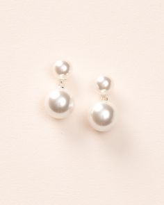 Our Nadine Pearl Dangle Earrings are simple & chic. Add a touch of elegance to any look with these earrings designed with small lustrous off white pearls accented with a larger pearl dangle. Off white, glass pearls 0.75" length Hypoallergenic, lead-free & nickel-free Earrings will match with both ivory and white gowns Style #4455 Elegant White Pearl Embellished Earrings, Classic Pearl Earrings For Parties, Cream Pearl Drop Jewelry, Elegant White Pearl Earrings With Pearl Buttons, Delicate Pearl White Pearl Earrings For Evening, Pearl White Pearl Earrings, White Pearl Embellished Earrings For Formal Occasions, Elegant White Bridal Earrings With Pearl Chain, White Pearl Button Earrings For Wedding