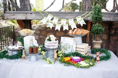 a table topped with lots of food and decorations