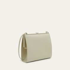 Saint Laurent "Le-Anne Marie" shoulder bag in glossy faux leather (polyurethane) Adjustable shoulder strap  Framed top with lift-clasp closure  Interior, one slip pocket  Approx. 8.5"H x 7.1"W x 2.5"D Professional cleaning recommended Made in Italy Beige Evening Flap Bag With Detachable Strap, Formal Beige Shoulder Bag With Fold Over Clasp, Beige Evening Flap Bag With Magnetic Closure, Beige Flap Bag With Magnetic Closure For Evening, Beige Box Bag With Detachable Strap For Evening, Beige Shoulder Bag With Magnetic Closure For Evening, Beige Evening Bag With Fold Over Clasp, Desert Sand, Anne Marie