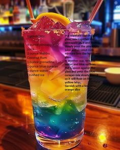 a colorful drink is sitting on the bar