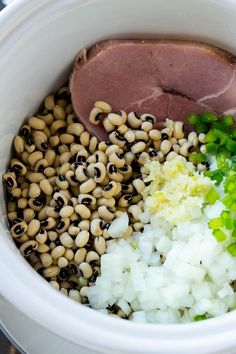 the food in the bowl is prepared and ready to be put into the slow cooker