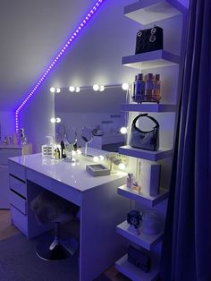 a white desk topped with lots of drawers under a purple light filled sky above it