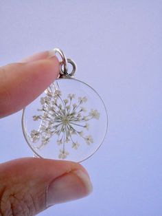 "Our Arrowhead Frame has a modern bohemian feel and is available in a variety of real preserved botanicals. Choose from 24k gold plated or .999 sterling silver plated. The Dandelion Seed symbolizes wishes. The Fern is a symbol of sincerity Forget-me-nots are known as a symbol of lasting friendship, love, and remembrance Lavender is a symbol of devotion Pendant hangs from a gold or silver plated chain, available in 26\" or 30\" lengths. Choose from plain chain or satellite chain, see picture for Nature-inspired Jewelry With Flower Charm For Anniversary, Delicate Flower Birth Flower Jewelry, Nature-inspired Jewelry With Flower Charm, Delicate Pressed Flower Jewelry, Unique Pressed Flower Jewelry, Botanical Jewelry With Birth Flower Pendant, Botanical Style Jewelry With Birth Flower Pendant, Nature-inspired Flower Necklace For Anniversary, Sterling Silver Jewelry With Natural Inclusions As Gift