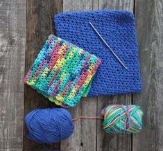 yarn and crochet items laid out on wooden surface